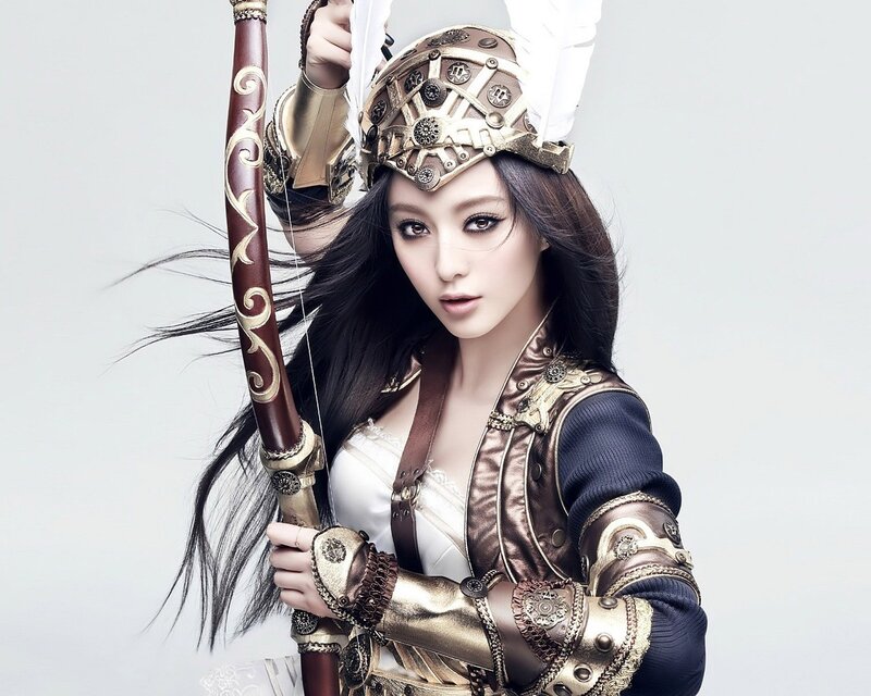 Woman in Armor Holding Bow — White, Dramatic, Photograph, Helmet, Brown, Gold