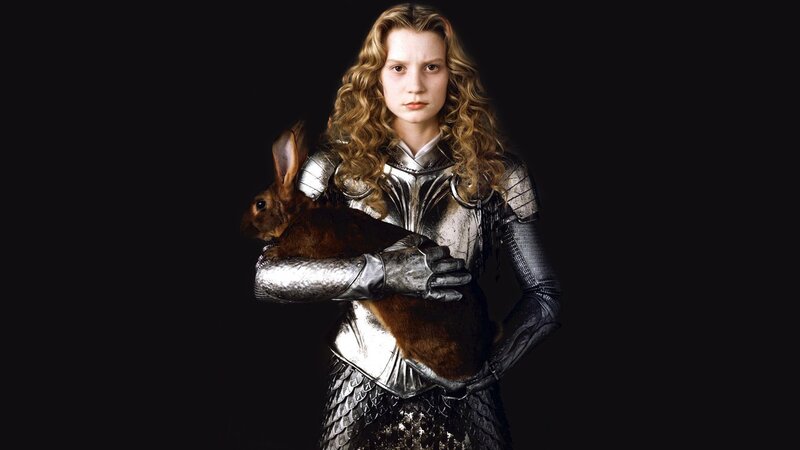 woman in armor holding rabbit