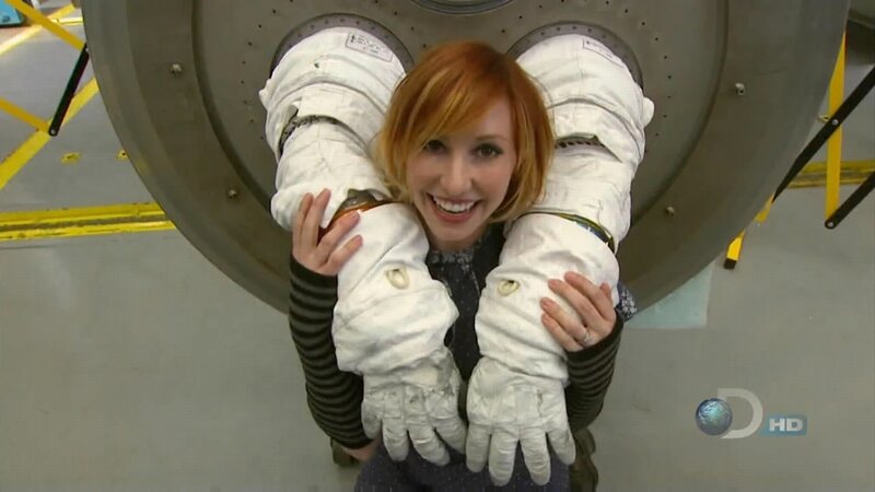 woman in astronaut gloves