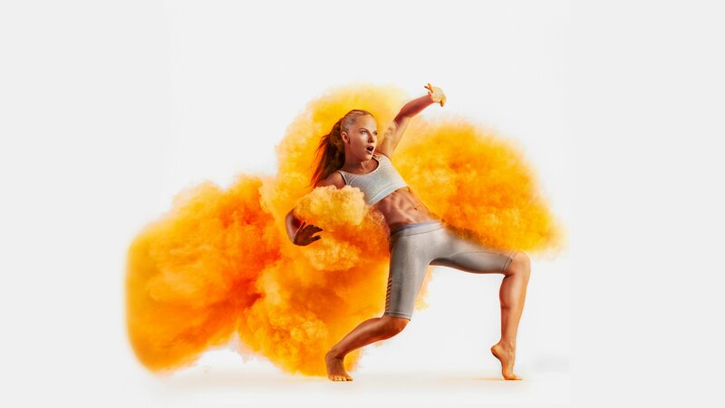 Woman in Athletic Pose — Orange