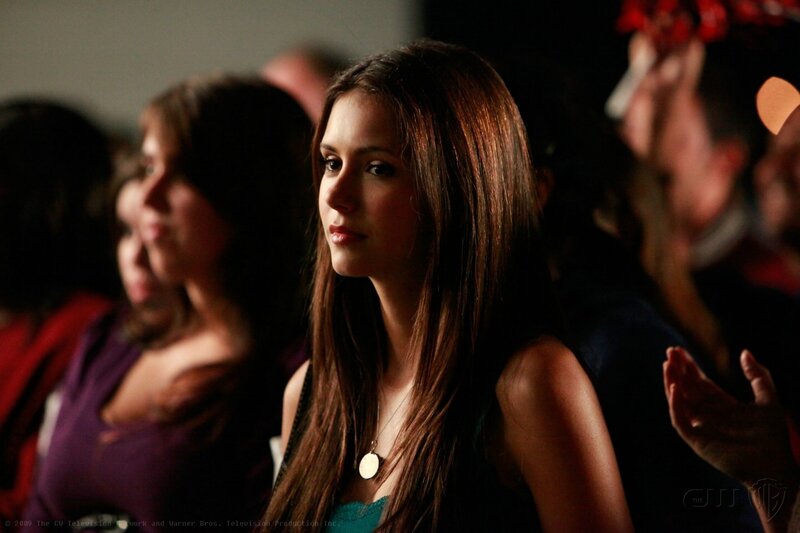 woman in audience watching event