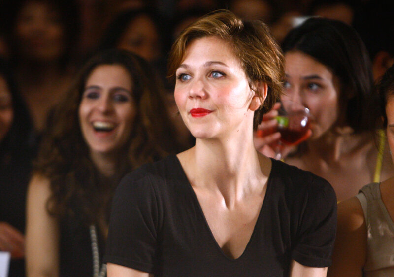 woman in audience watching event