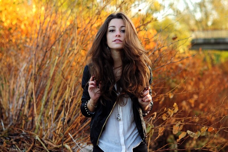 woman in autumn foliage