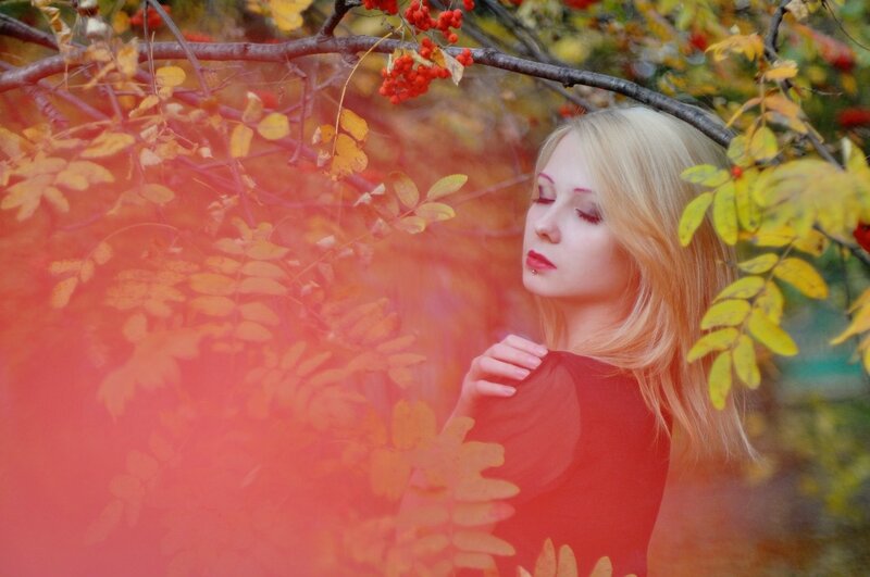 woman in autumn foliage