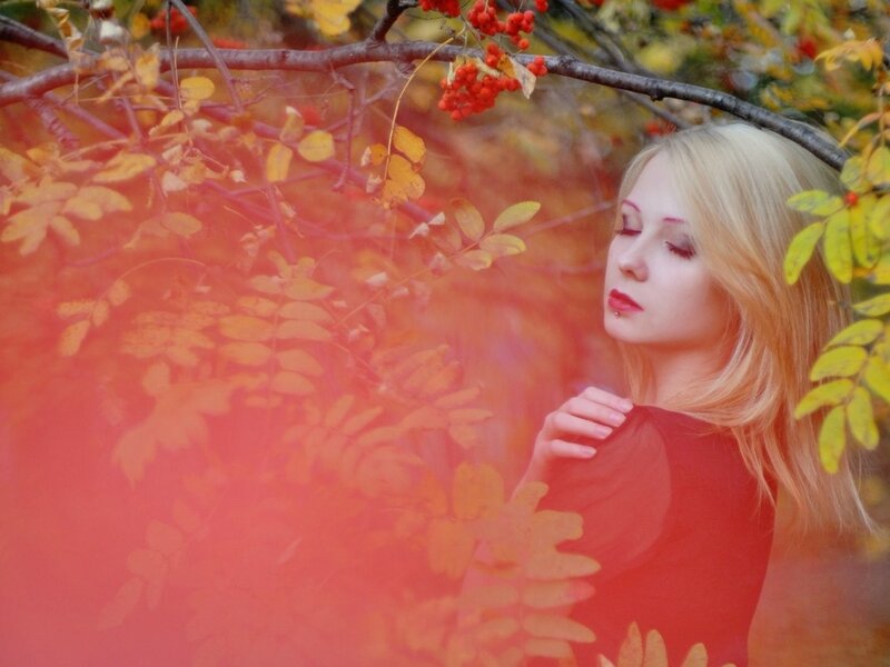 Woman in autumn foliage