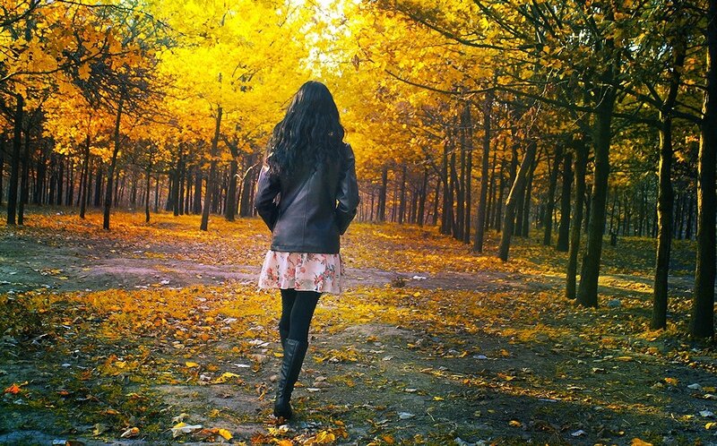 Woman in autumn forest