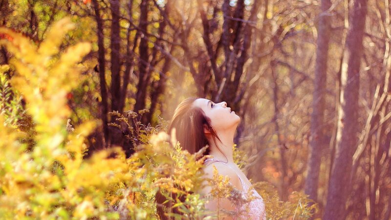 woman in autumn forest