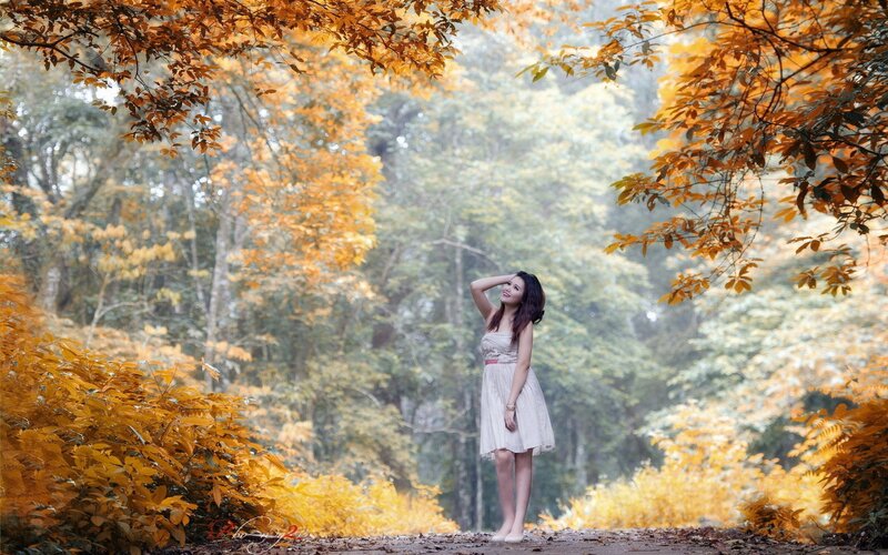 Woman in autumn forest