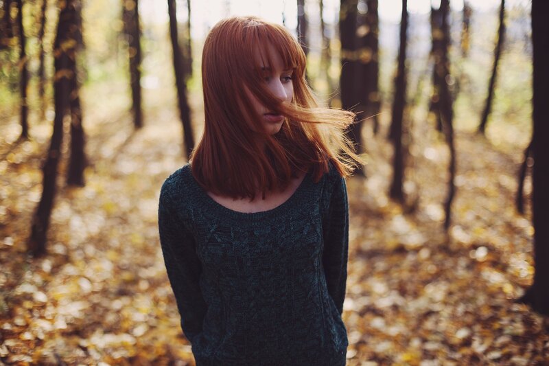Woman in autumn forest