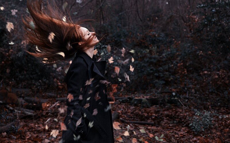 Woman in autumn forest