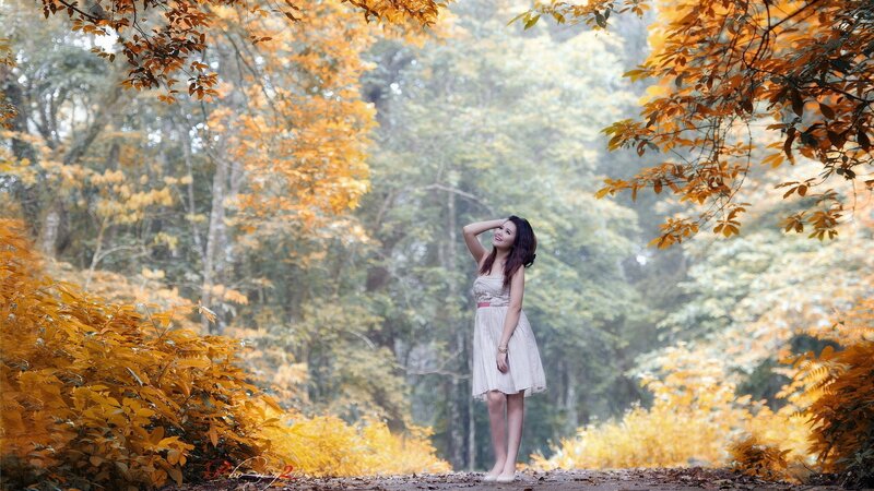 Woman in autumn forest