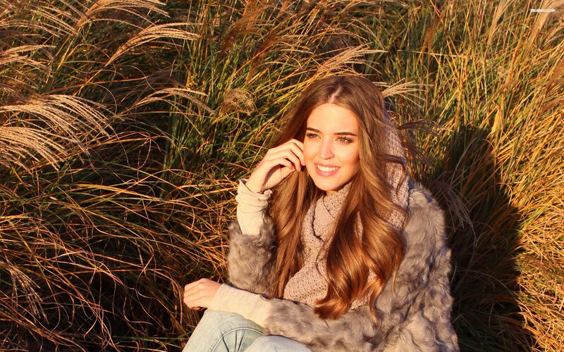 woman in autumn grass