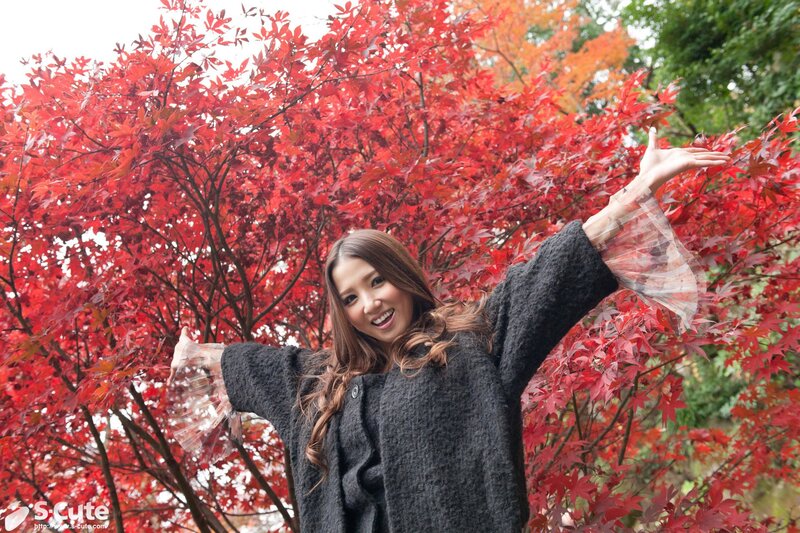 woman in autumn leaves