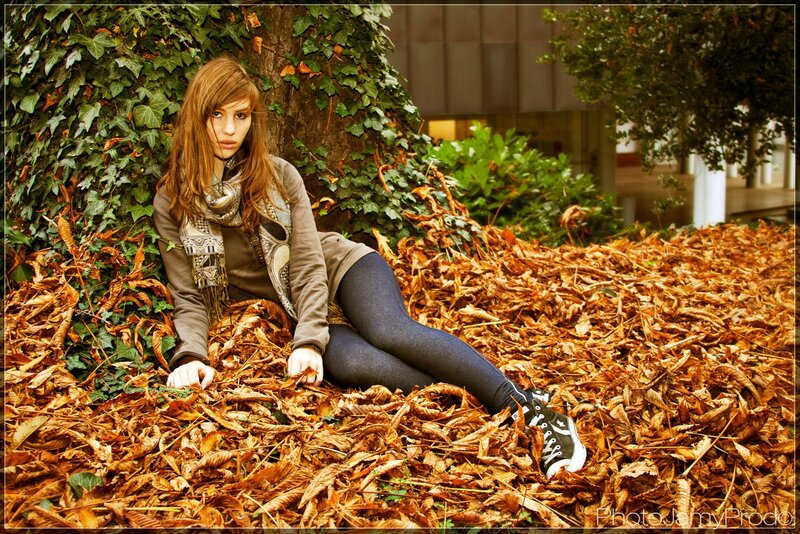 woman in autumn leaves