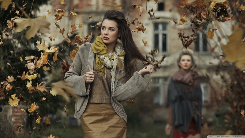Woman in autumn leaves