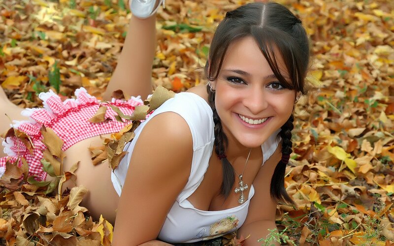 woman in autumn leaves