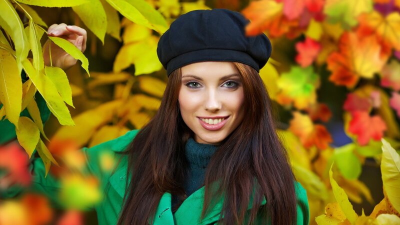 woman in autumn leaves