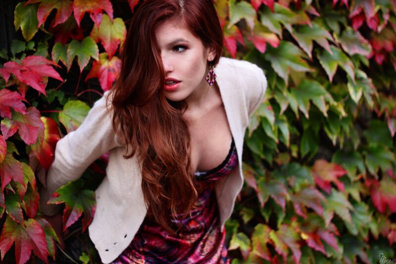 woman in autumn leaves