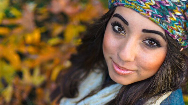 woman in autumn leaves