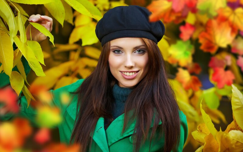 woman in autumn leaves