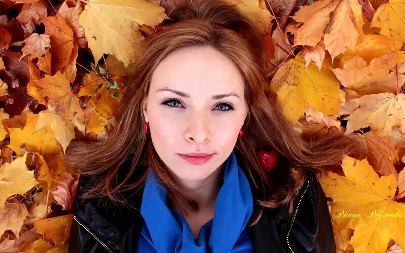 woman in autumn leaves