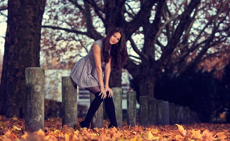 woman in autumn leaves