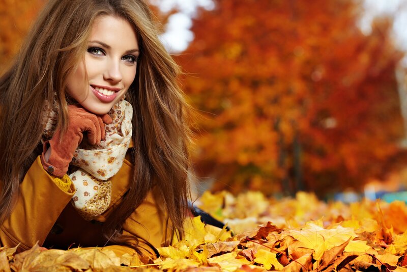 woman in autumn leaves