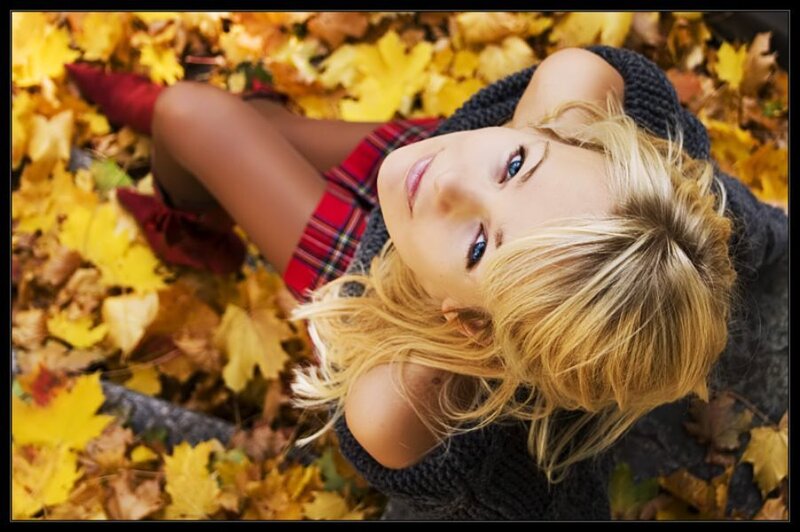 woman in autumn leaves