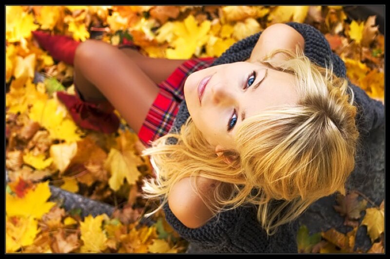 woman in autumn leaves