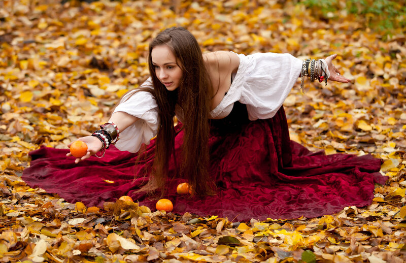 Woman in Autumn Leaves — Yellow, Dramatic, Photograph