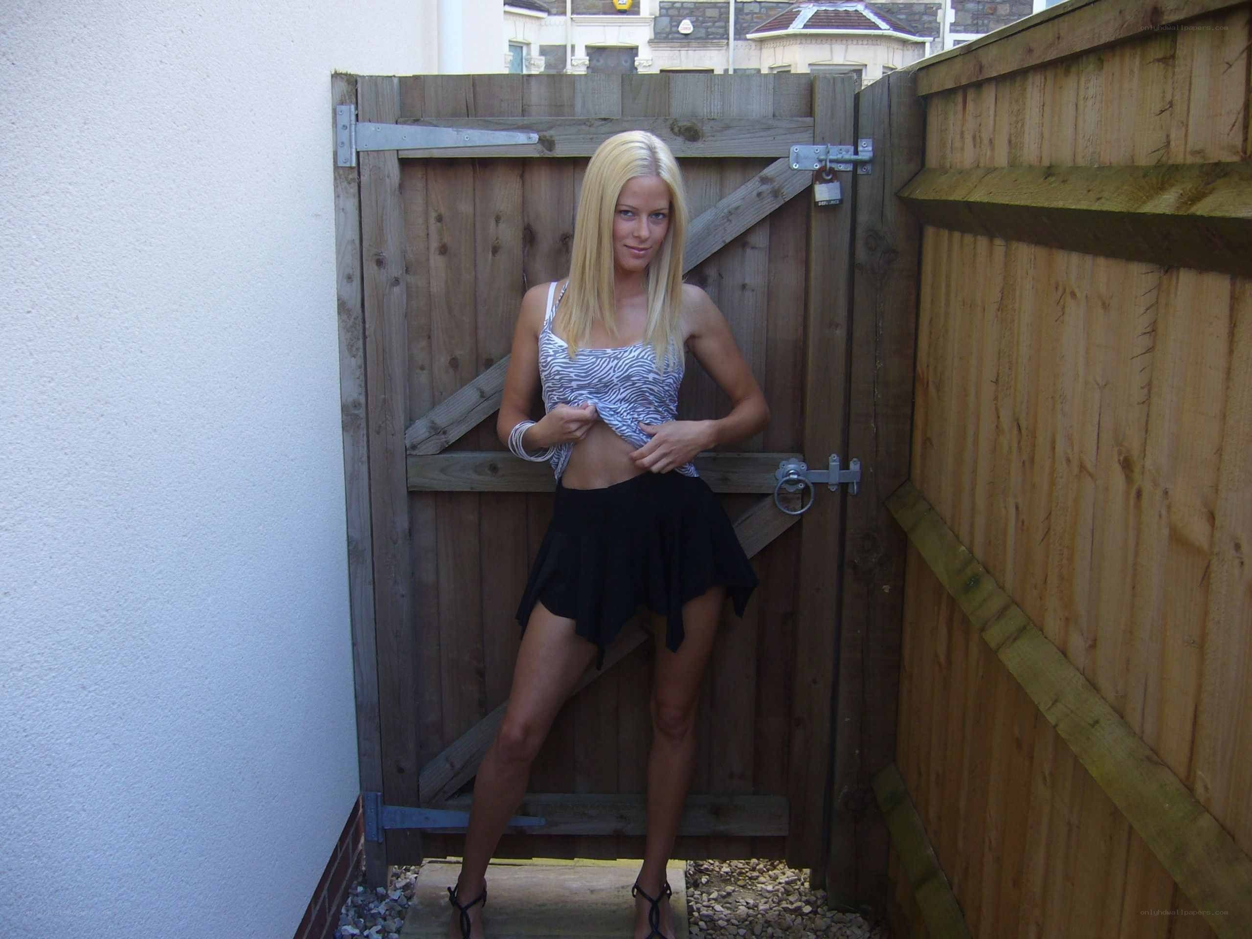 woman in backyard by gate