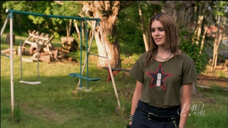 woman in backyard with swings