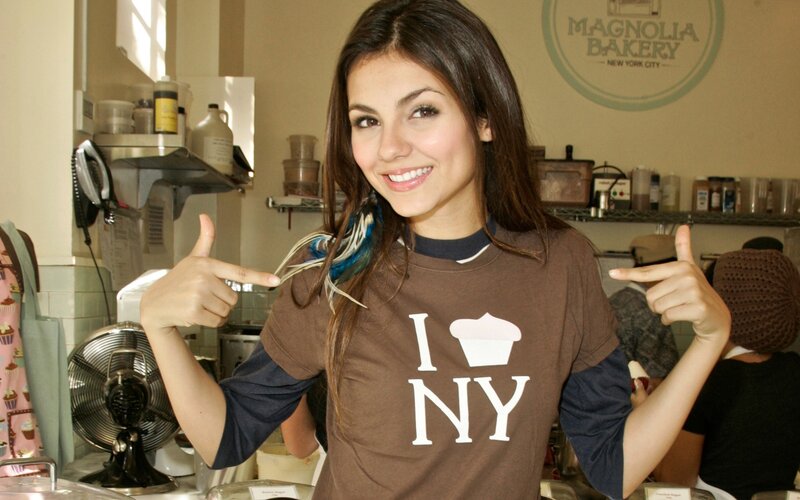 Woman in bakery with I love NY shirt
