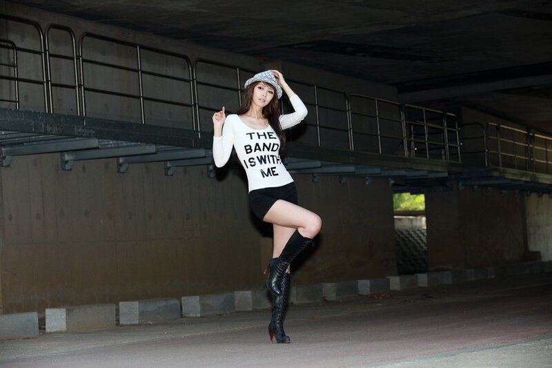 woman in band t-shirt posing