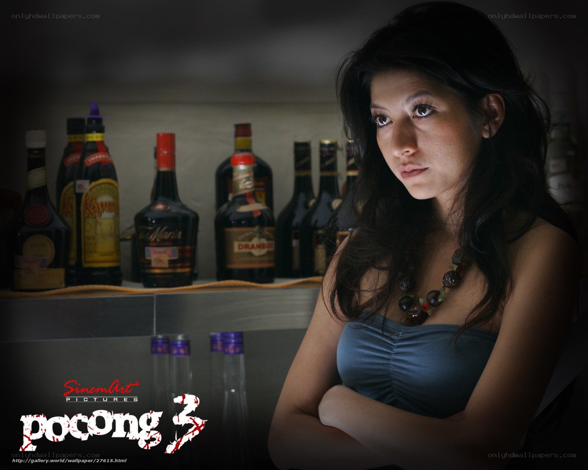 woman in bar with alcohol bottles