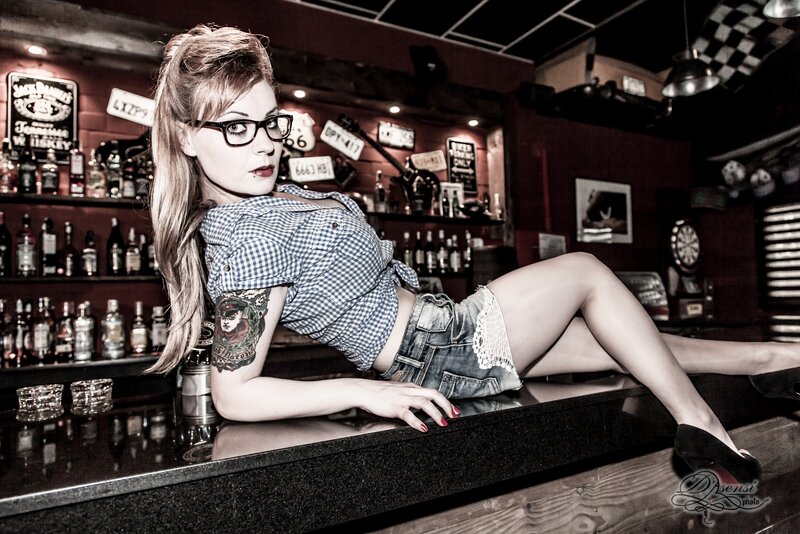 woman in bar with glasses