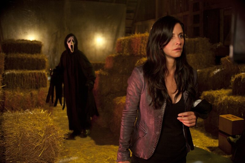 Woman in Barn with Masked Figure
