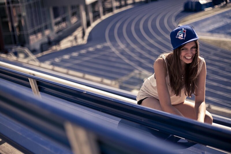 Woman in baseball cap at track
