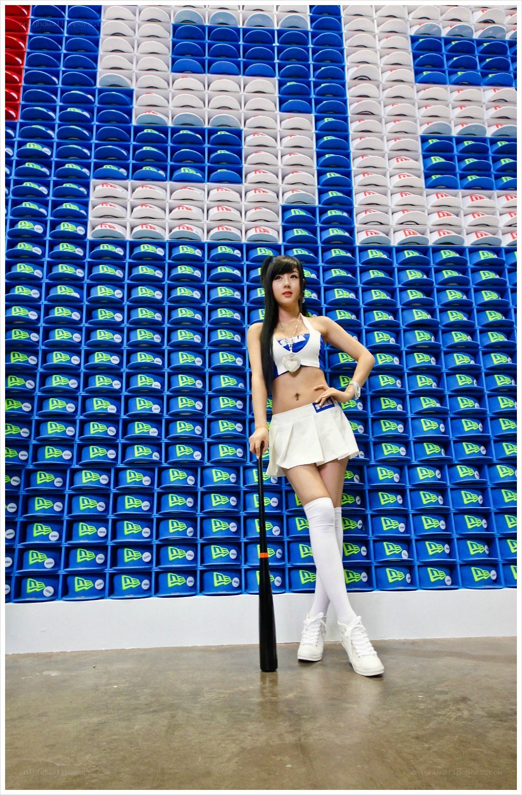woman in baseball uniform posing