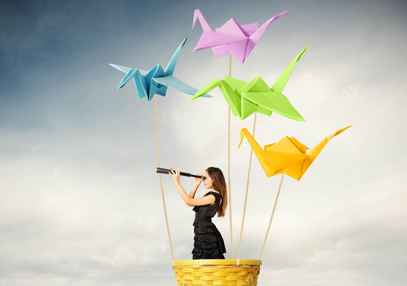 Woman in Basket with Origami Cranes