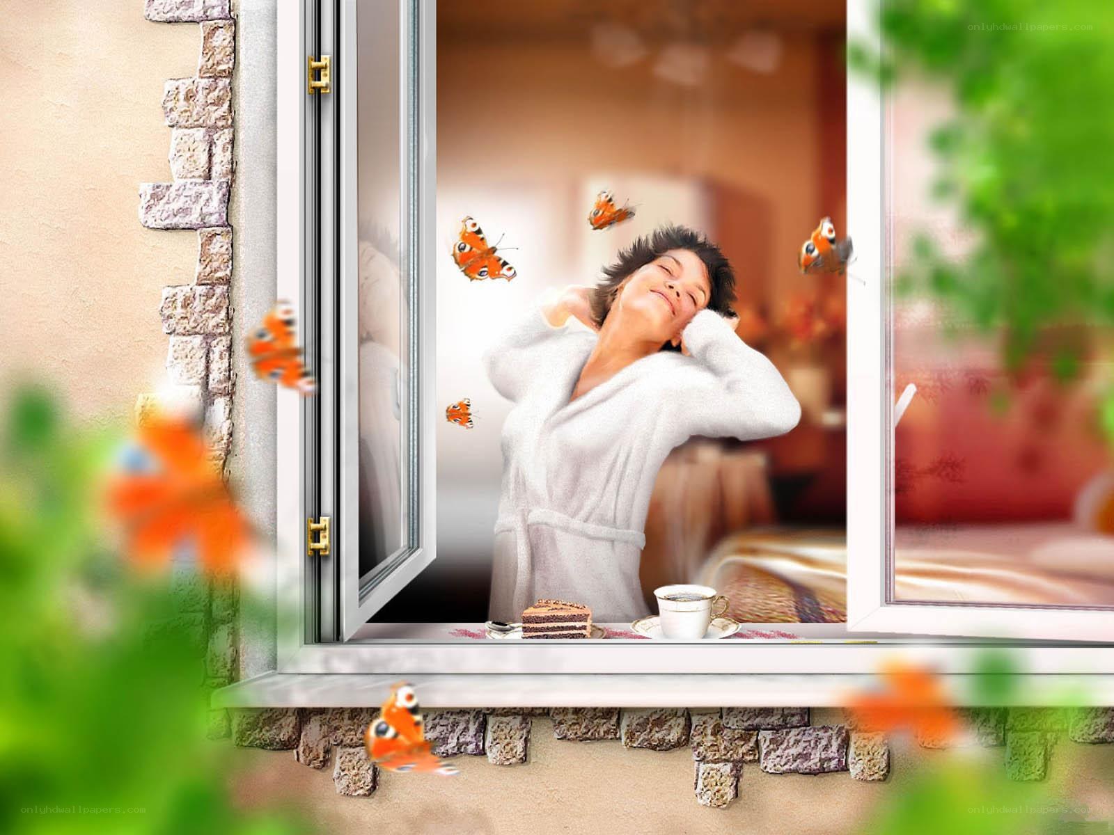 Woman in bathrobe by window
