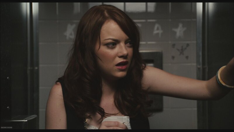 woman in bathroom holding cup