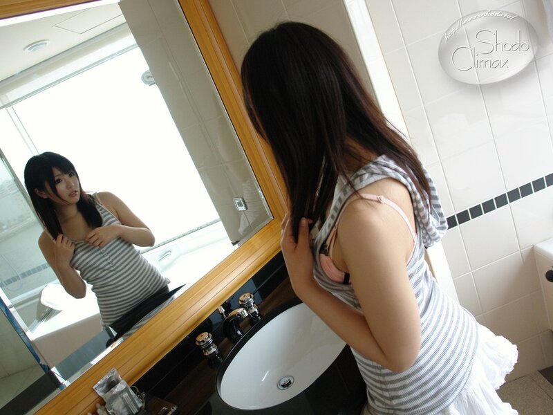 woman in bathroom mirror