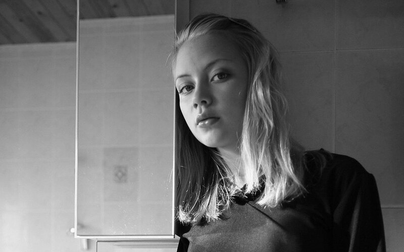 woman in bathroom mirror
