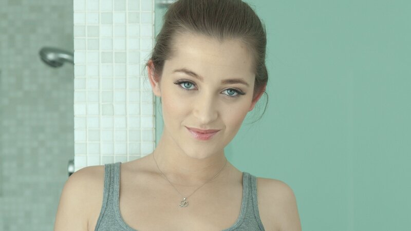 woman in bathroom smiling