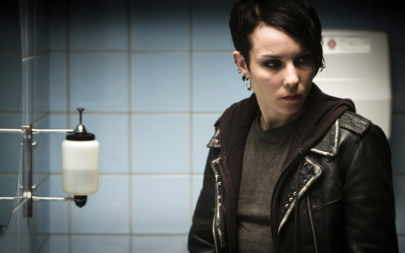 woman in bathroom wearing leather jacket