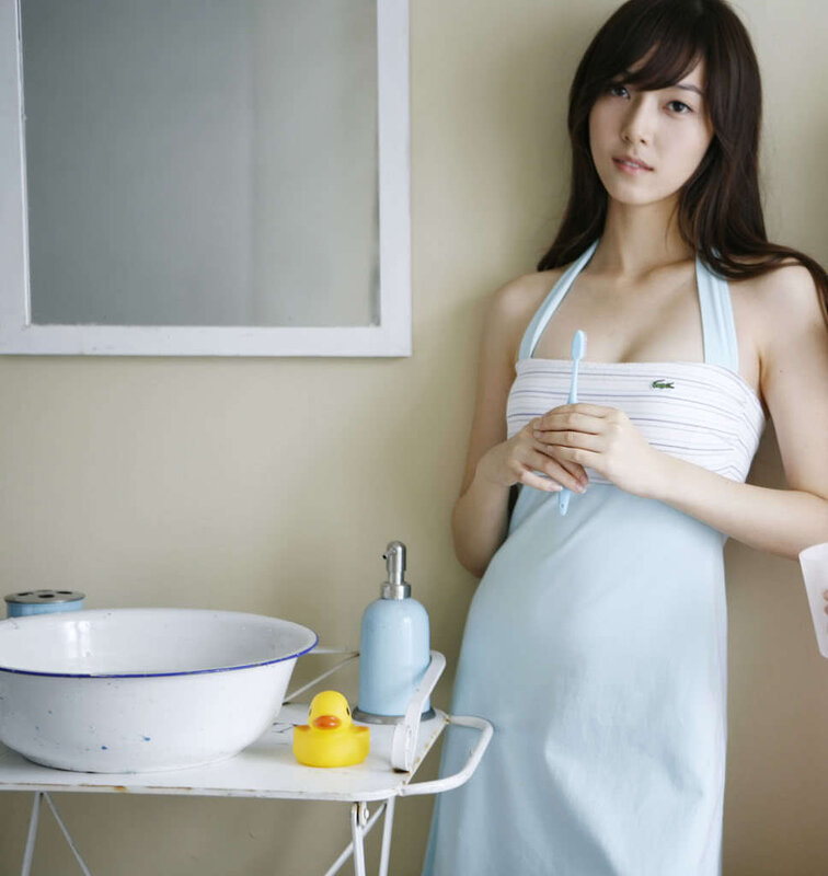 woman in bathroom with toothbrush