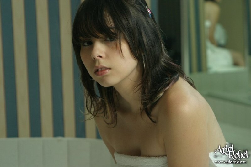 woman in bathroom with towel
