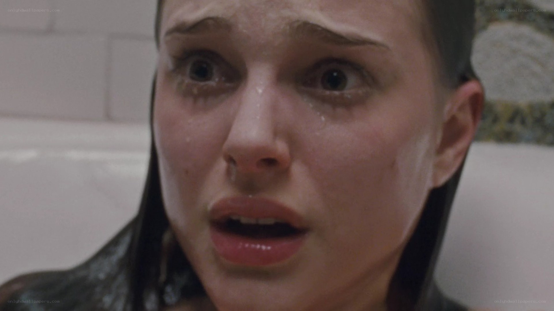 woman in bathtub crying
