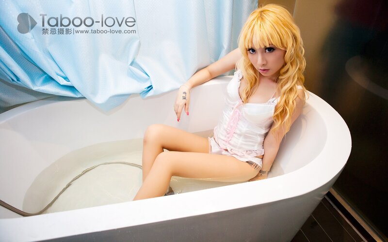 woman in bathtub with blonde hair